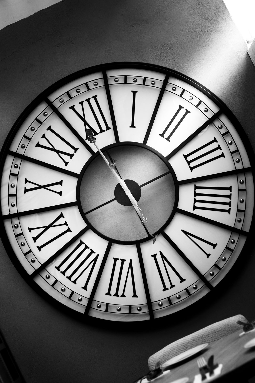 A wall clock in a quiet dining room