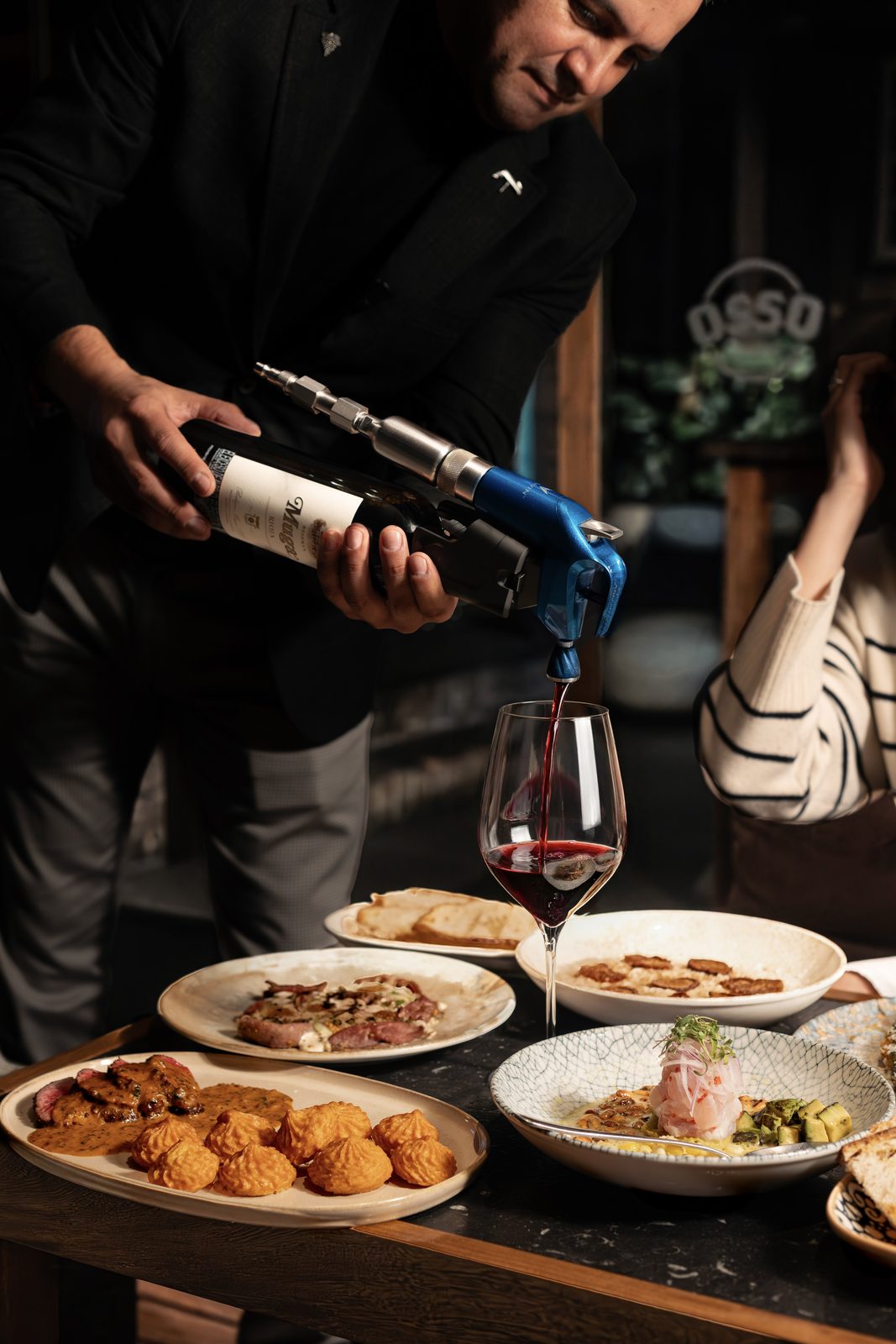 The table, set — wine poured over the dishes